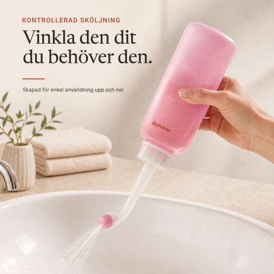 Hand holding the Relievoo peri bottle upside down and rinsing over a basin rvpumpen rvhasar