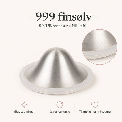 Close-up of a brushed 999 fine silver nursing cup showing its satin dome and clear silicone rim rvpumpen rvhasar
