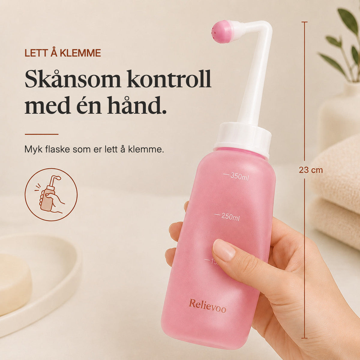 Hand squeezing the 23 cm Relievoo peri bottle with one hand rvpumpen rvhasar