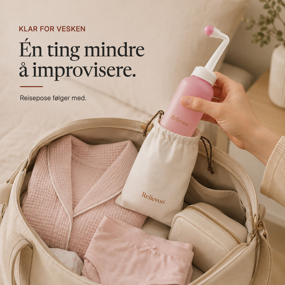 Hand slipping the Relievoo peri bottle into its travel pouch inside a packed hospital bag rvpumpen rvhasar